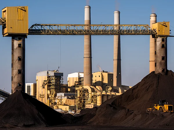 Large piles of coal stored at a coal-fired power plant