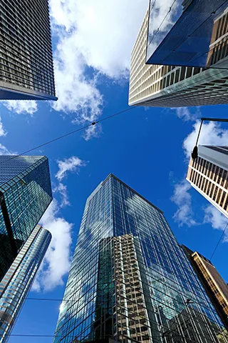 Several office buildings standing on a street