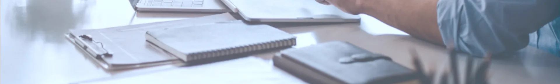 Employees discussing at a desk with filter bags