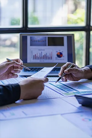 Two employees discussing a report