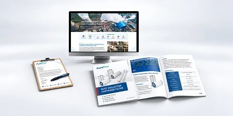 Many brochures placed beside a computer.