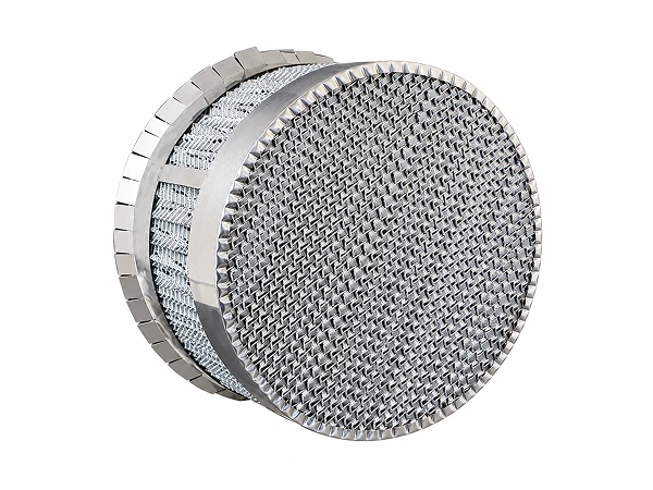 A piece of Metal Perforated Corrugated Packing placed on a flat surface
