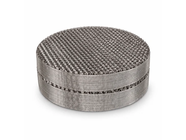 A Metal wire gauze structured packing element placed on a flat surface