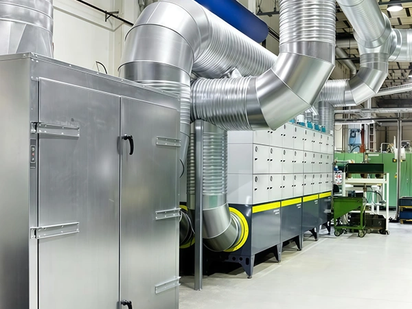 An oil mist purifier connected to other equipment