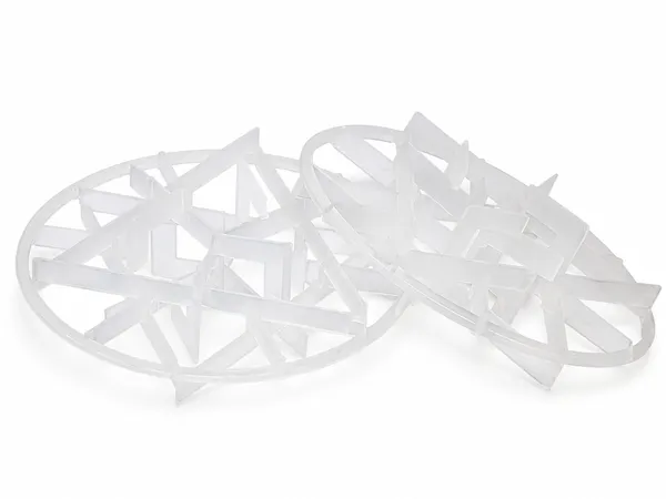 Two plastic snowflake ring packing elements placed together