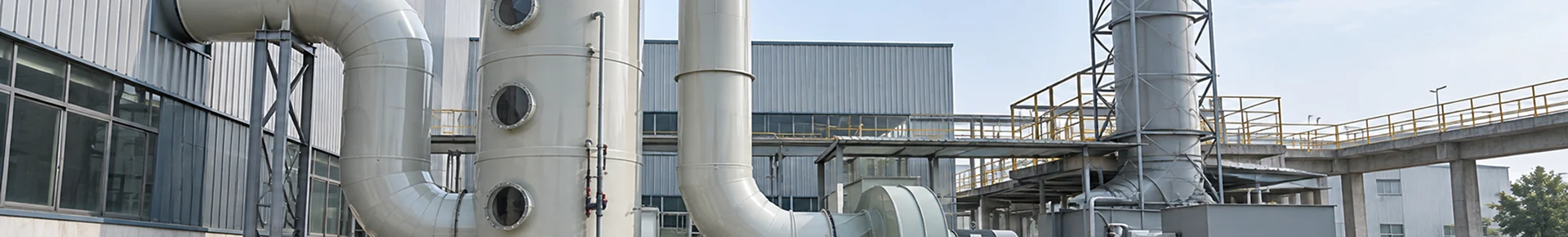 A complete wet scrubber system is installed in a factory.